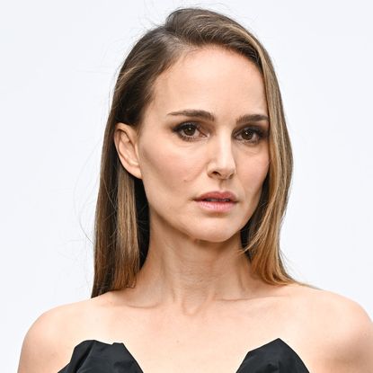 Natalie Portman wearing an off the shoulder dress with her hair down and in a deep side part.