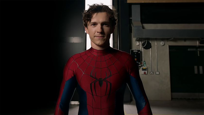 Tom Holland wearing his new Spider-Man suit and smiling in a behind the scenes video for Spider-Man: Brand New Day
