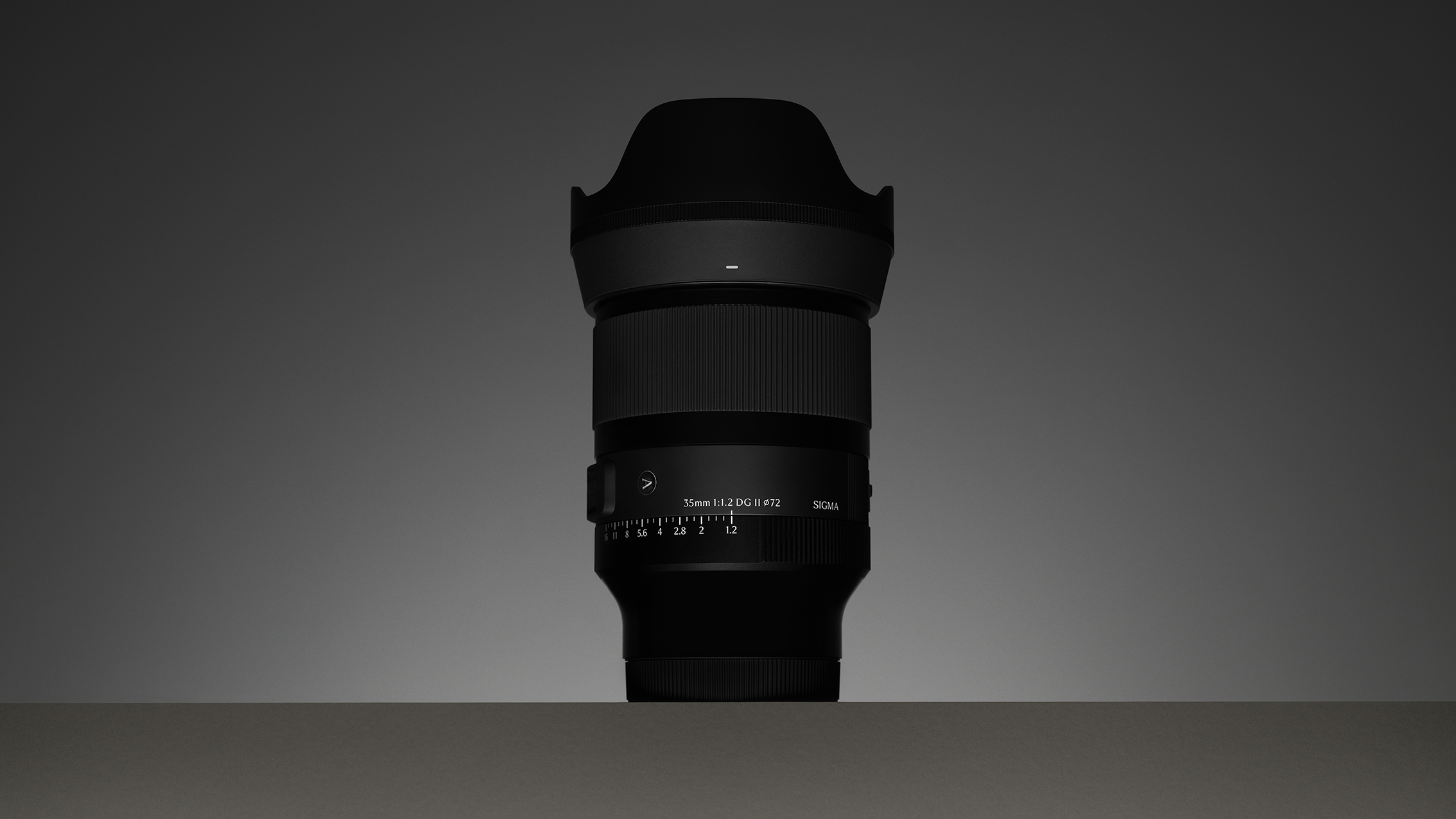 Sigma 35mm F1.2 DG II Art lens with a wide hood is centrally positioned against a gradient gray background, creating a sleek and professional tone