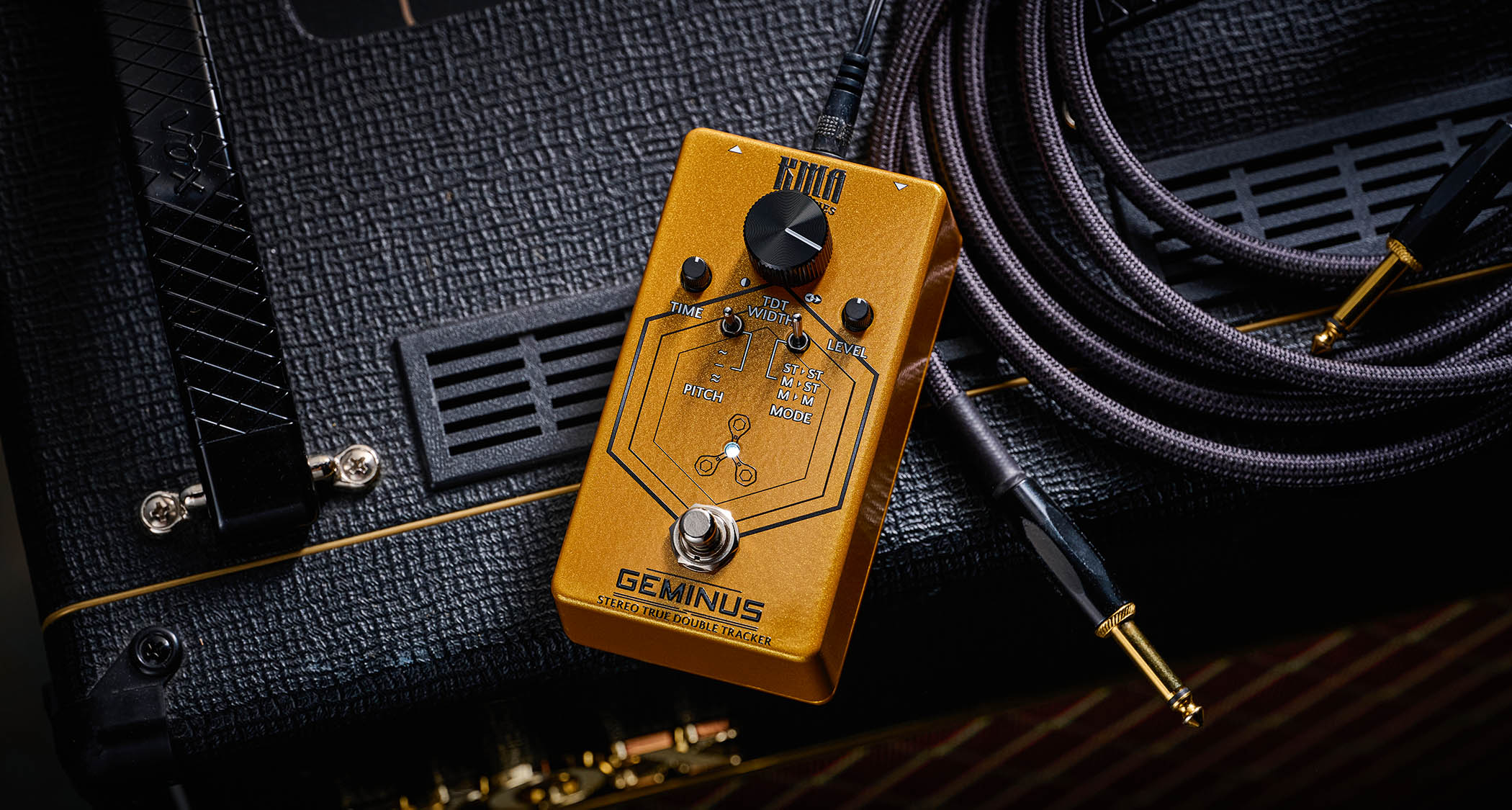KMA Geminus Stereo True Double Tracker: the gold stompbox&#039;s fascia is dominated by one large black dial and is photographed here in close-up.