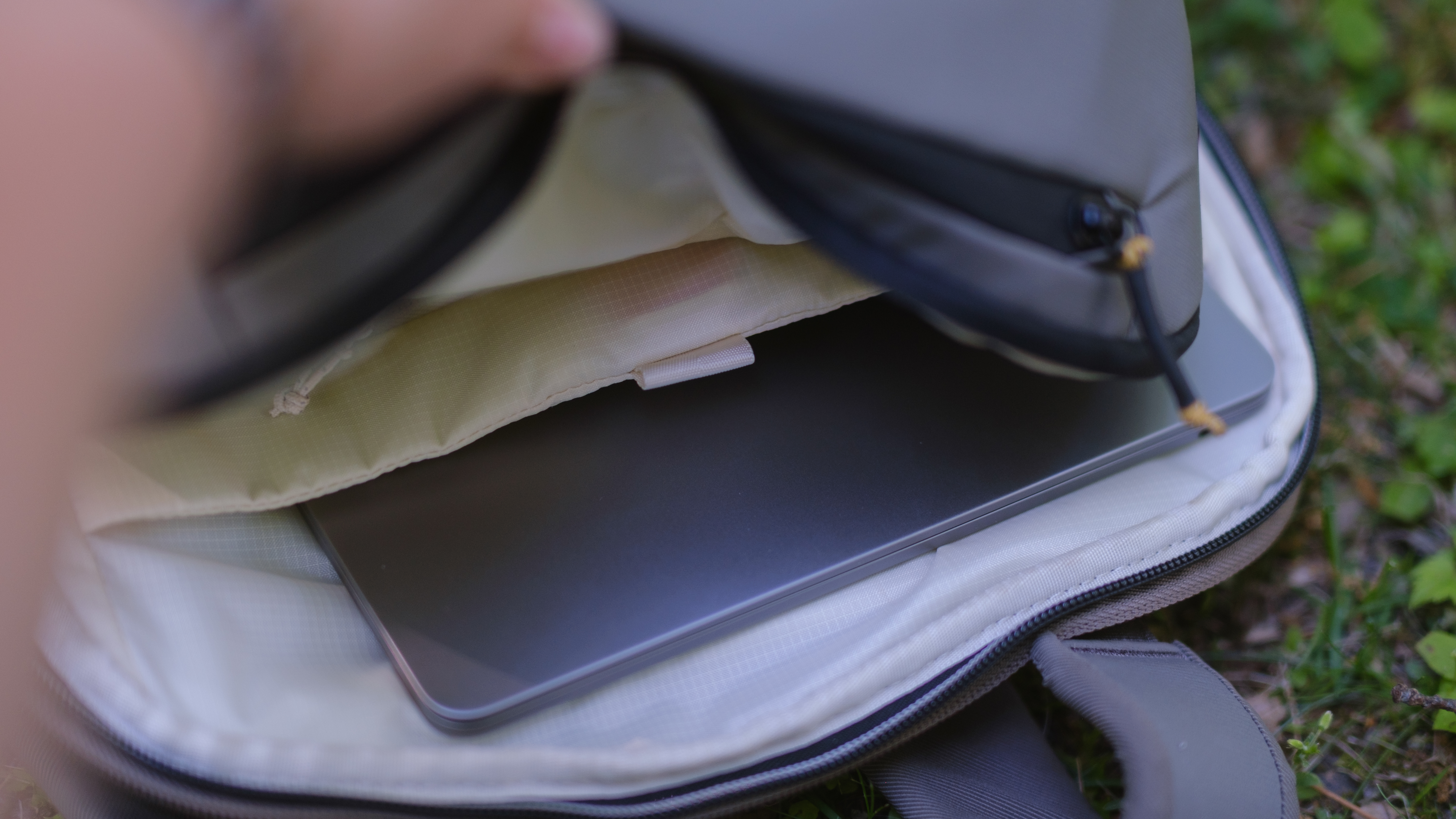 The Peak Design Travel 2-in-1 Backpack outdoors used by a photographer