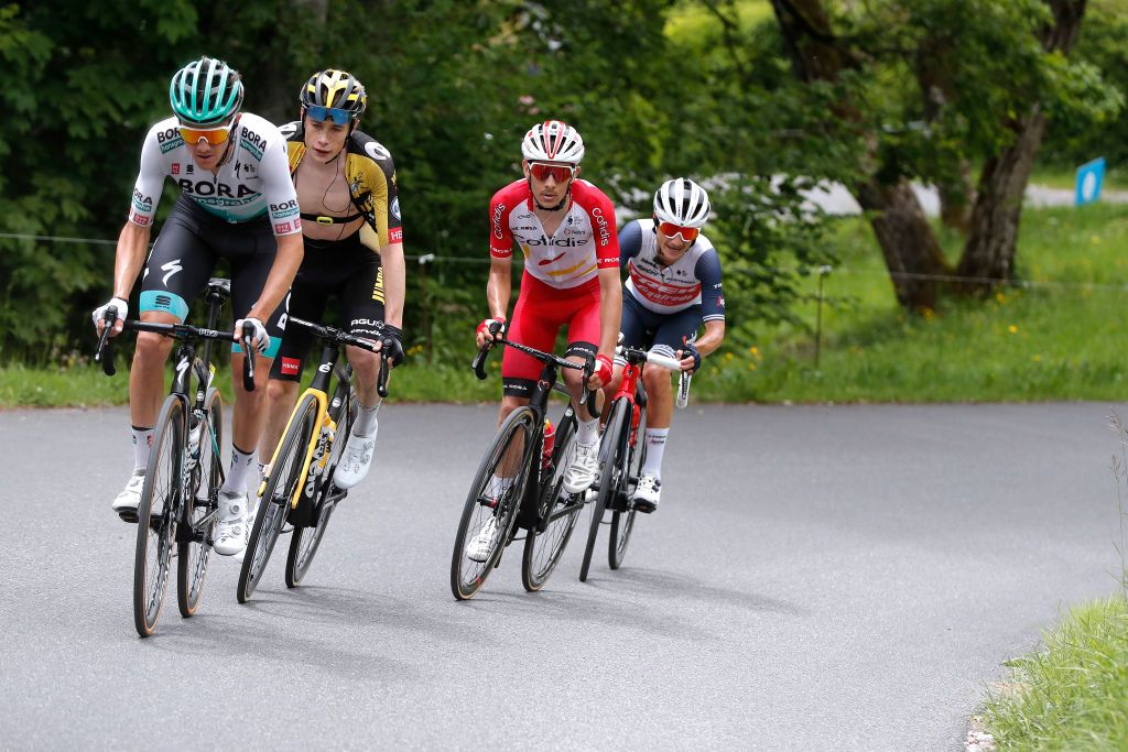 LES GETS FRANCE JUNE 06 Patrick Konrad of Austria and Team Bora Hansgrohe Jonas Vingegaard Rasmussen of Denmark and Team Jumbo Visma Guillaume Martin of France and Team Cofidis Kenny Elissonde of France and Team Trek Segafredo during the 73rd Critrium du Dauphin 2021 Stage 8 a 147km stage from La LchreLesBains to Les Gets 1160m UCIworldtour Dauphin dauphine on June 06 2021 in Les Gets France Photo by Bas CzerwinskiGetty Images