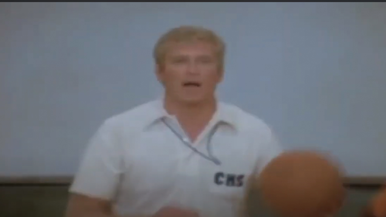 Ken reeves holding a basketball in White Shado