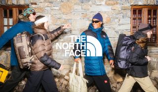Several people wearing north face clothing with the north face logo in front