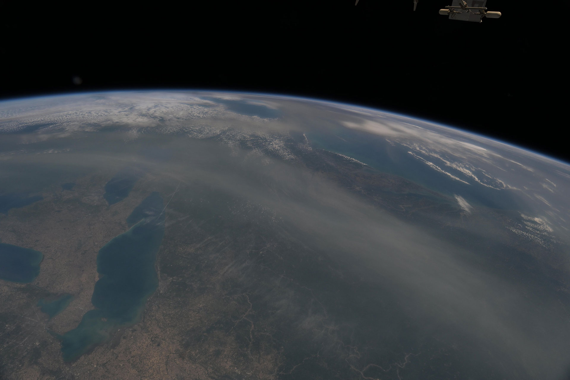 Smoke from wildfires can be seen spreading across Earth from the vantage point of orbit