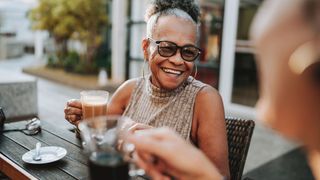 A woman laughing with a friend