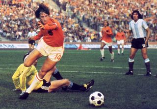 Johan Cruyff on the ball for the Netherlands against Argentina at the 1974 World Cup.