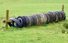 How to make your own jumps EG5DN9 many worn pneumatic vehicle tyres used as a practice jump for training horses
