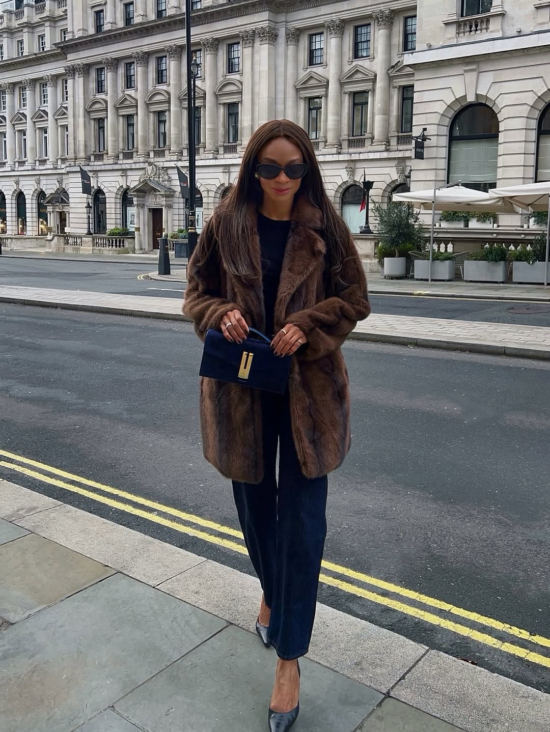woman wearing brown faux fur coat 2026