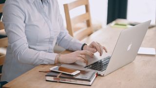 A person using a laptop at home