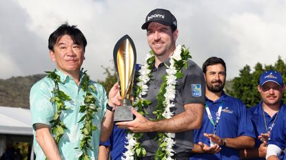 Nick Taylor with the Sony Open in Hawaii trophy