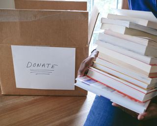 putting books into a donations box