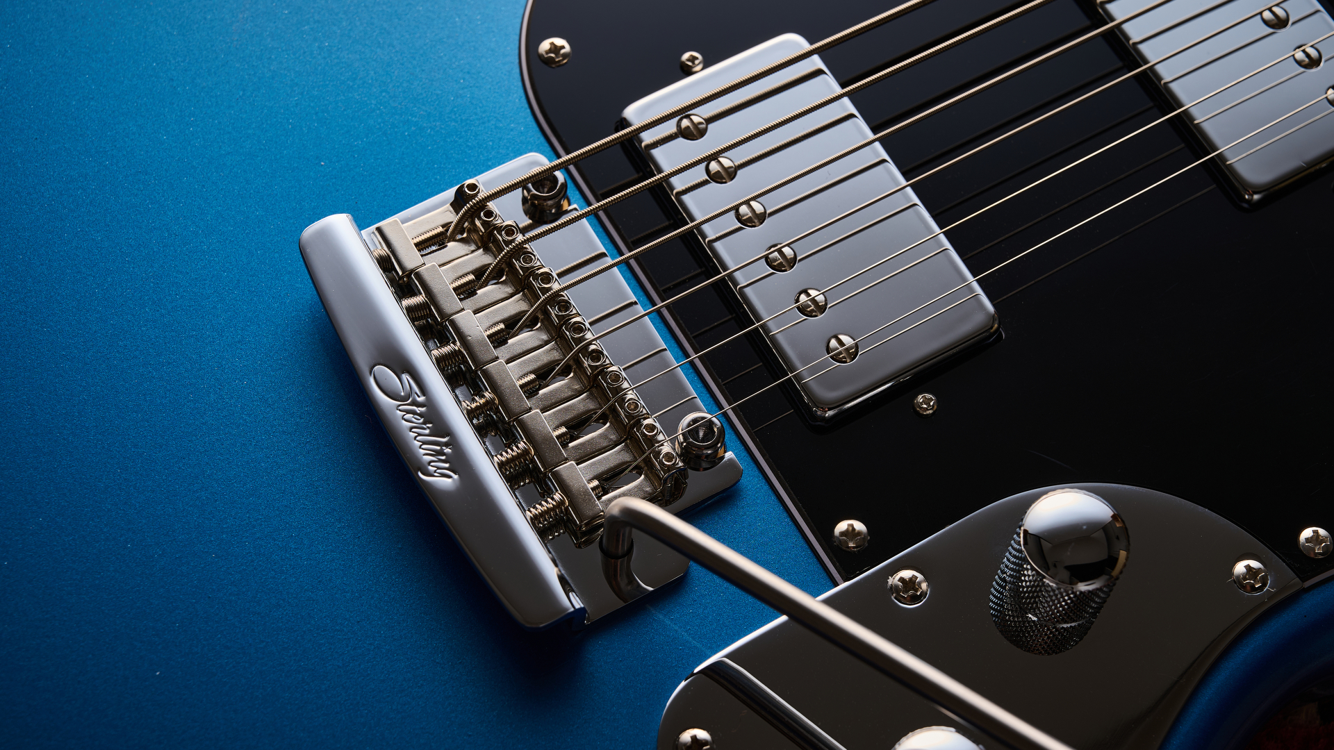 Close up of the bridge and humbucker on the Sterling by Music Man StingRay Baritone guitar