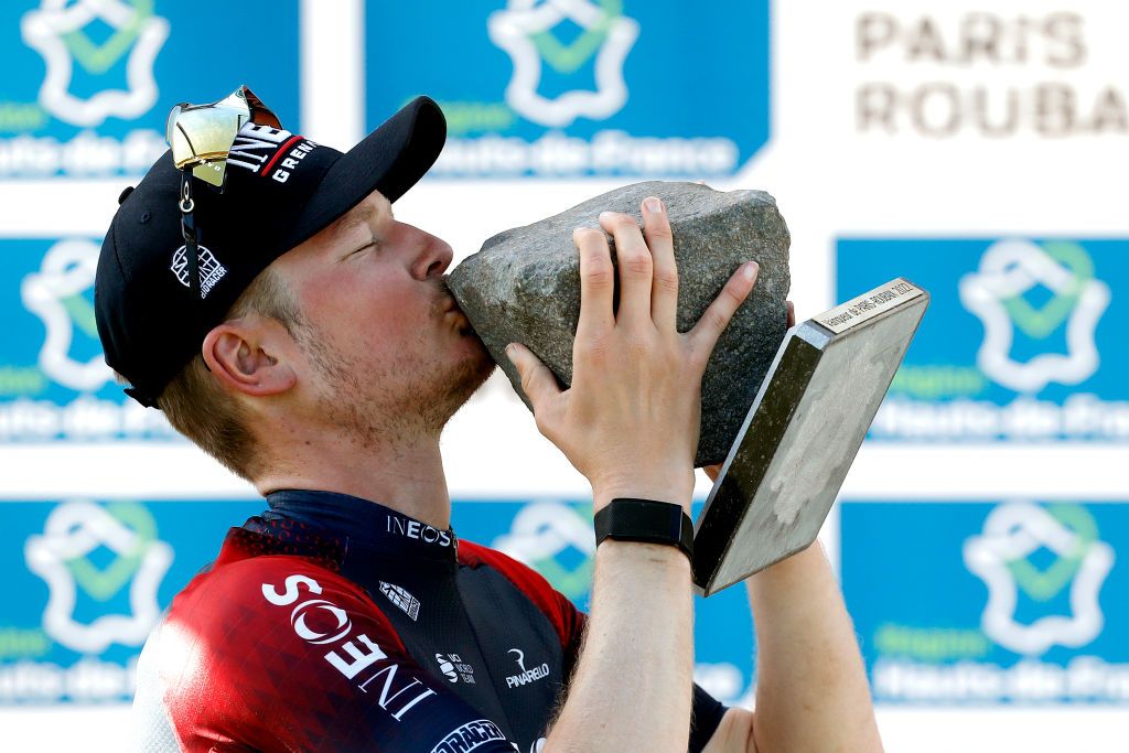 ROUBAIX FRANCE APRIL 17 Dylan Van Baarle of Netherlands and Team INEOS Grenadiers celebrates winning the race and kisses the Cobbleston trophy with his Oakley sunglasses on the podium ceremony after the 119th ParisRoubaix 2022 Mens Elite a 2572km one day race from Compigne to Roubaix ParisRoubaix WorldTour on April 17 2022 in Roubaix France Photo by Bas CzerwinskiGetty Images