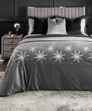 A grey bedroom by Next with velvet star-motif bedding