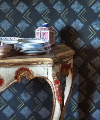 hand-stencilled walls and painted table on the dining room at Charleston House