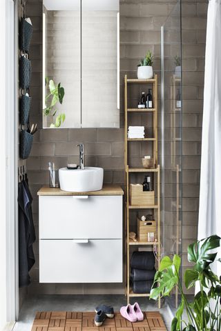 Ikea mirrored wall cabinet used as a bathroom storage idea