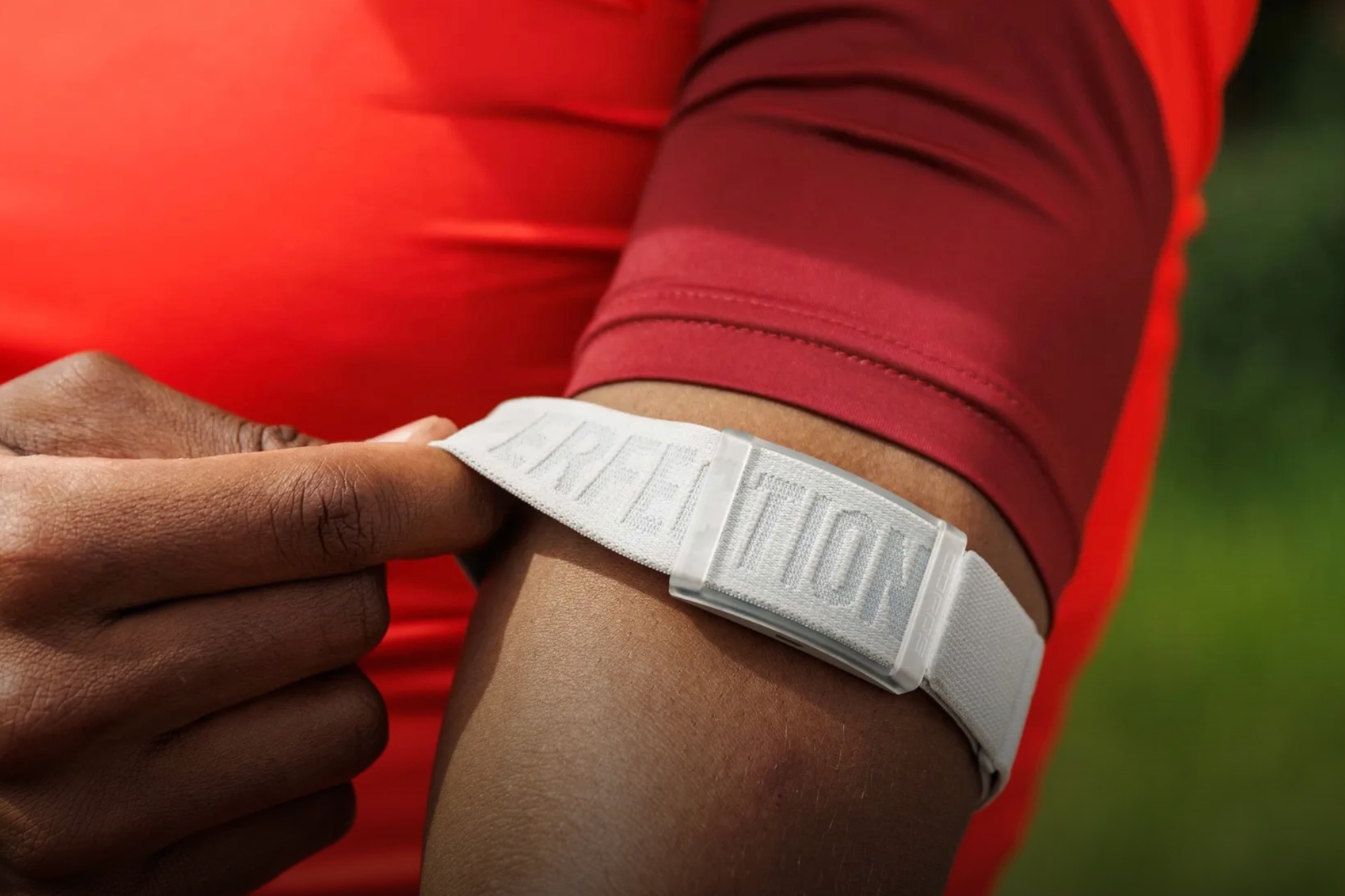 Coros Heart Rate Monitor is worn on a cyclists arm close up