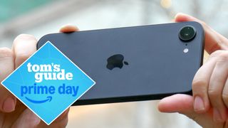 A person using the iPhone 16e to take a picture with a Tom's Guide deal badge added