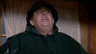 John Candy stressfully pressed against a door in The Great Outdoors.