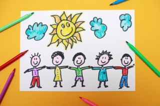 A child's drawing of people holding hands