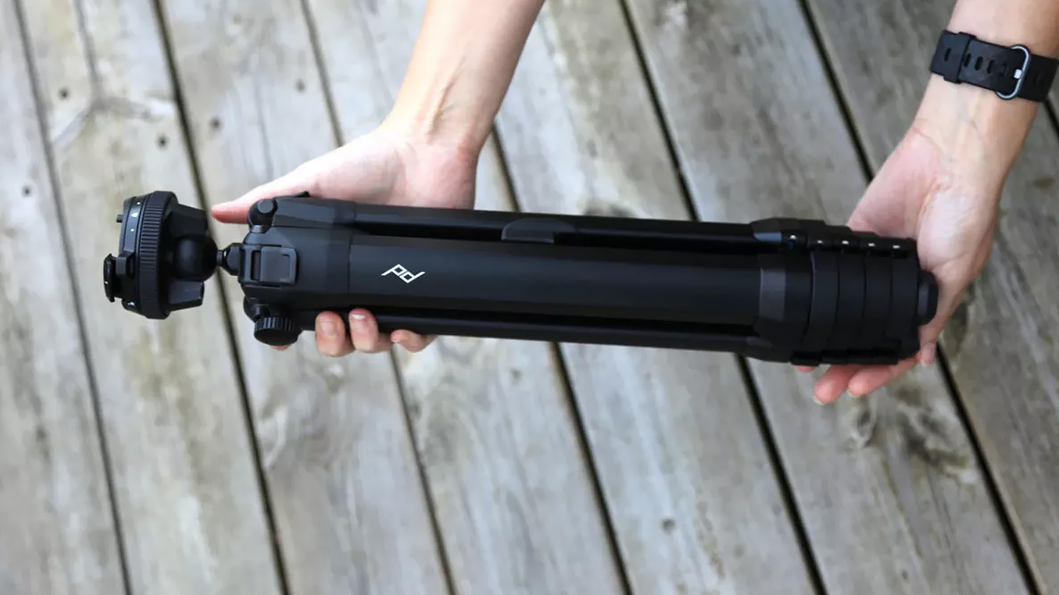 Review image of the Peak Design travel tripod in someone's hand.