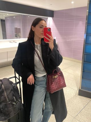 Anna LaPlaca wearing an Eterne Francis Sweater at the airport