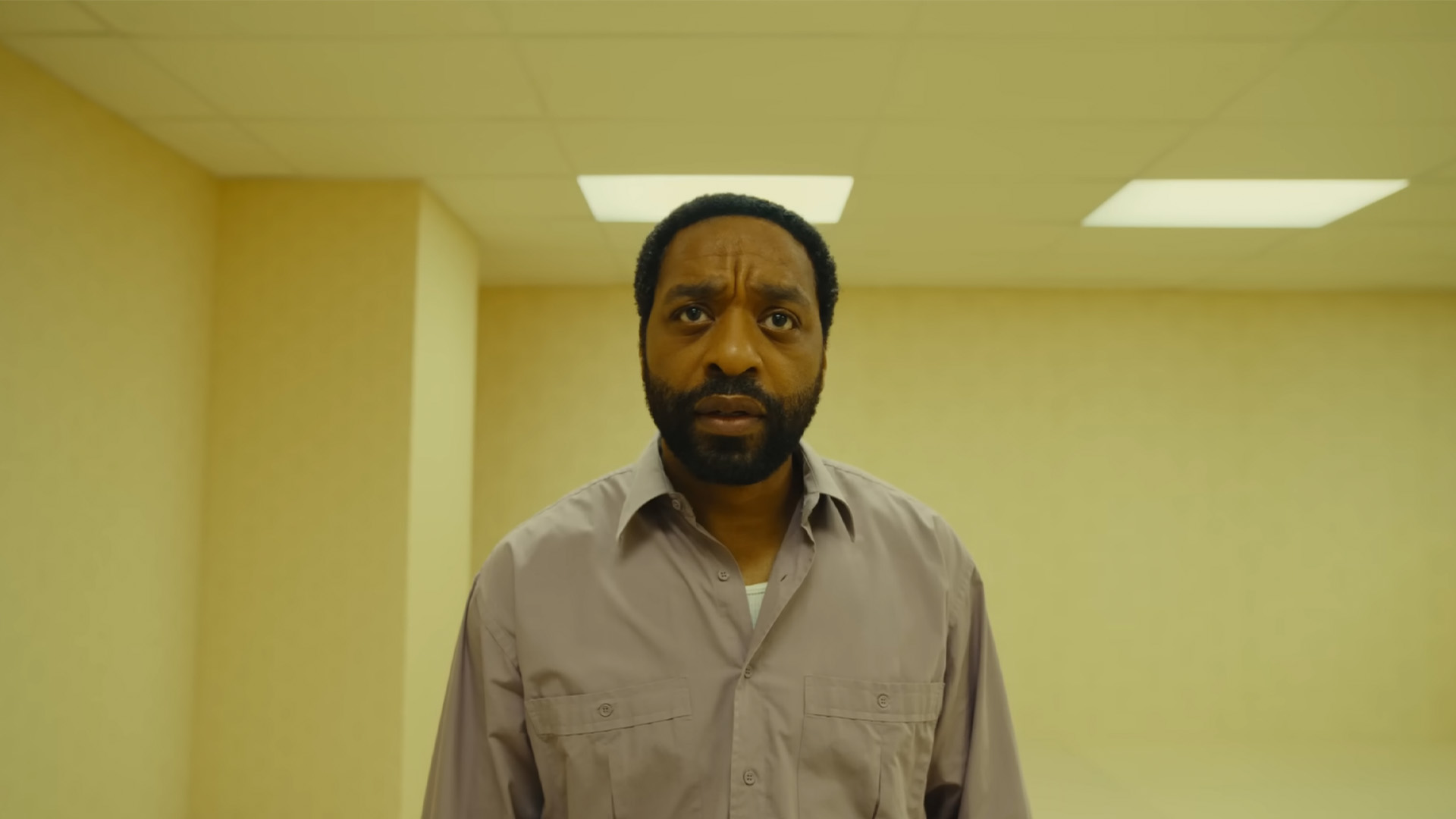 A24's The Backrooms trailer screenshot featuring protagonist looking confused in a pale yellow room