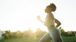 Is treadmill running easier than outdoor running: image of woman running outside