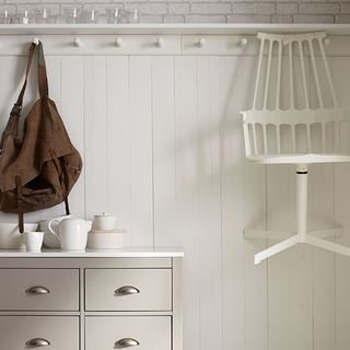 hallway with white coloured and hanging bag