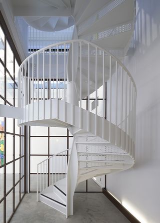 minimalist white twisting staircase