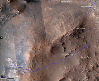 a reddish-brown landscape seen from above, with a blue line denoting a path across it