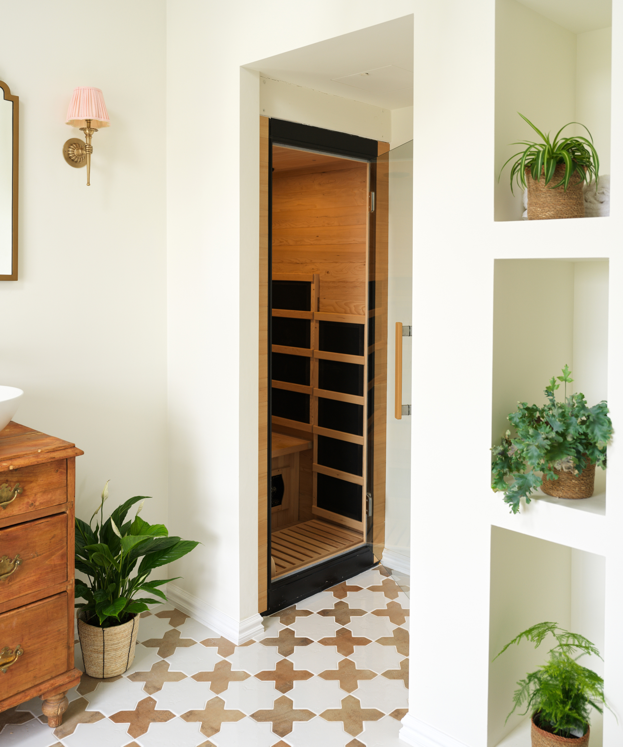 bathroom with small sauna room in one corner