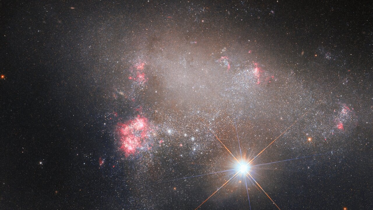 Hubble telescope captures star trying to outshine a galaxy (photo)