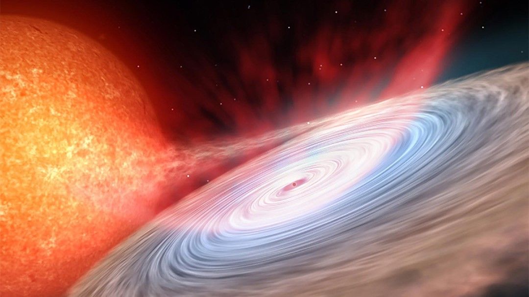 An artist&#039;s impression of a neutron star surrounded by a disk of material that it is stealing from a regular companion star.