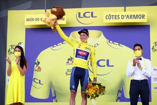MRDEBRETAGNE GUERLDAN FRANCE JUNE 27 Mathieu Van Der Poel of The Netherlands and Team AlpecinFenix yellow leader jersey stage winner celebrates at podium during the 108th Tour de France 2021 Stage 2 a 1835km stage from PerrosGuirec to MrdeBretagne Guerldan 293m Lion Mascot LeTour TDF2021 on June 27 2021 in MrdeBretagne Guerldan France Photo by Michael SteeleGetty Images