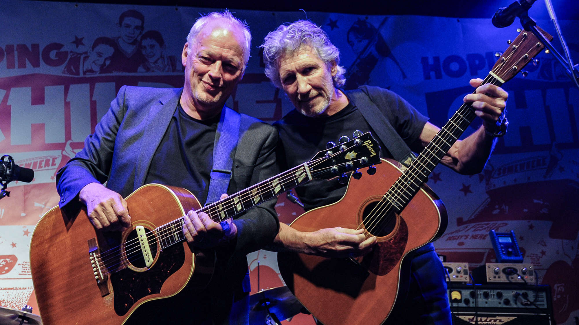 David Gilmour (L) and Roger Waters perform at a benefit evening for The Hoping Foundation on July 10, 2010 in London, England. 