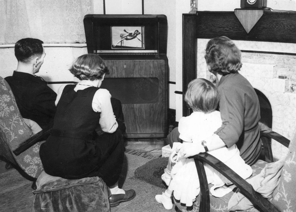 1950: A family watching athletics on television