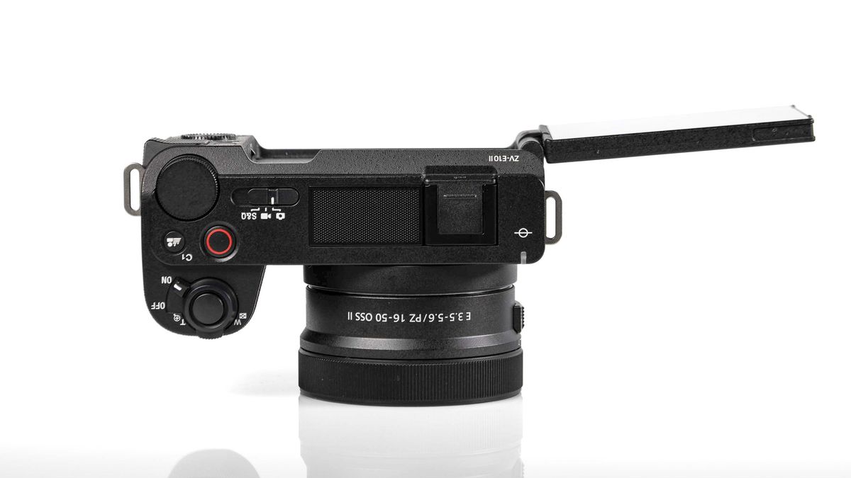 Sony ZV-E10 II on reflective surface and white background