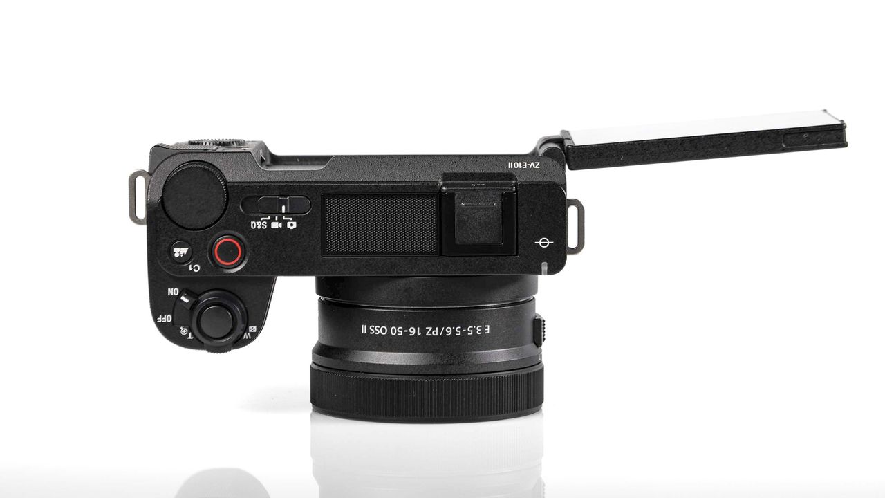 Sony ZV-E10 II on reflective surface and white background