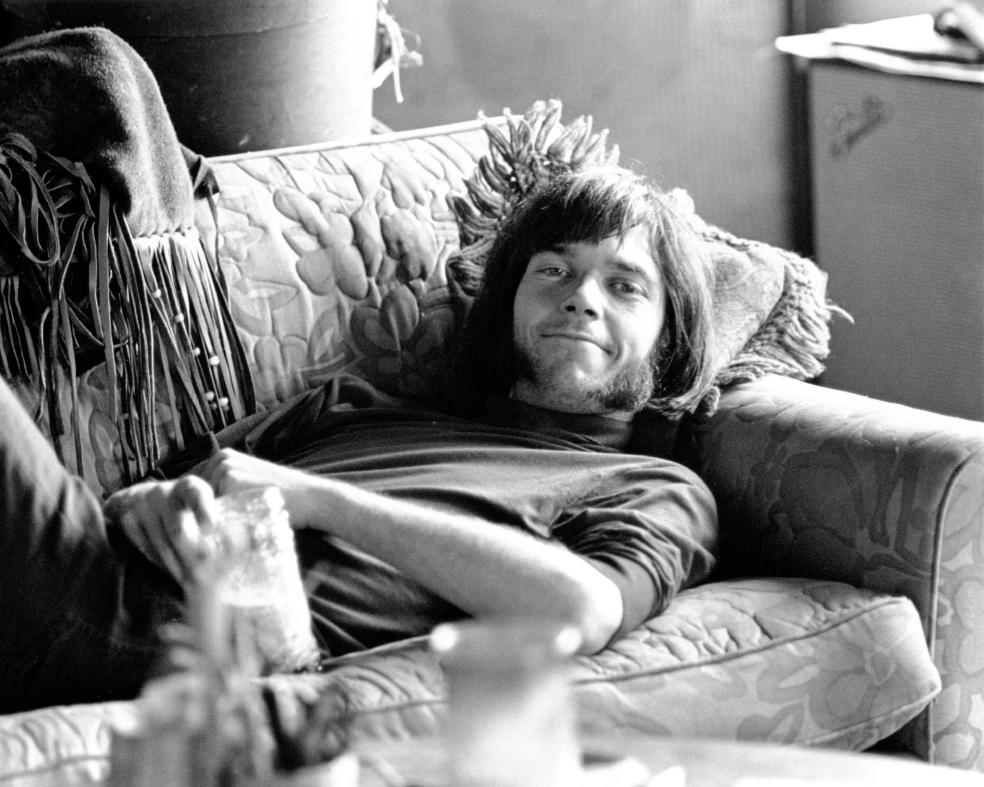 neil young on a floral sofa