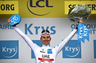 UAE Team Emirates teams Slovenian rider Tadej Pogacar celebrates with the best young riders white jersey on the podium after the 3rd stage of the 109th edition of the Tour de France cycling race 182 km between Vejle and Sonderborg in Denmark on July 3 2022 Photo by AnneChristine POUJOULAT AFP Photo by ANNECHRISTINE POUJOULATAFP via Getty Images
