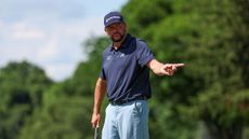 Michael Block points after holing a putt