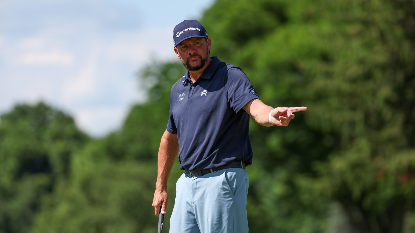 Michael Block points after holing a putt