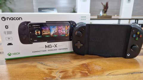 Nacon MG-X controller on a wooden table with its box