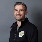 Male Pilates instructor smiles for portrait