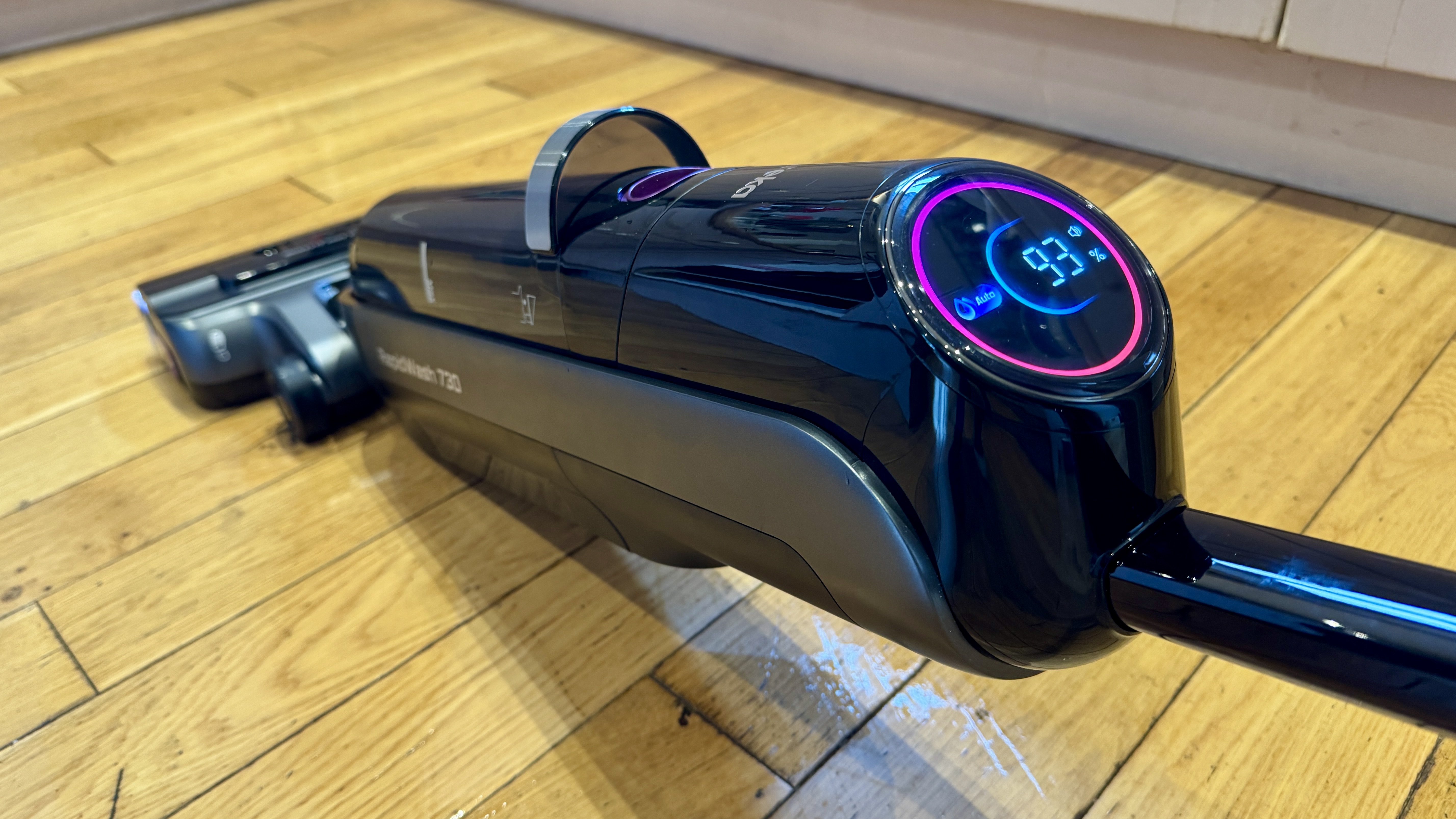 Eureka RapidWash 730 wet-and-dry vacuum in use on reviewer&#039;s engineered wood floor