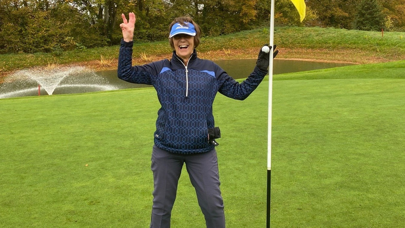 Lyn Parry with the ball after her third hole-in-one in the month