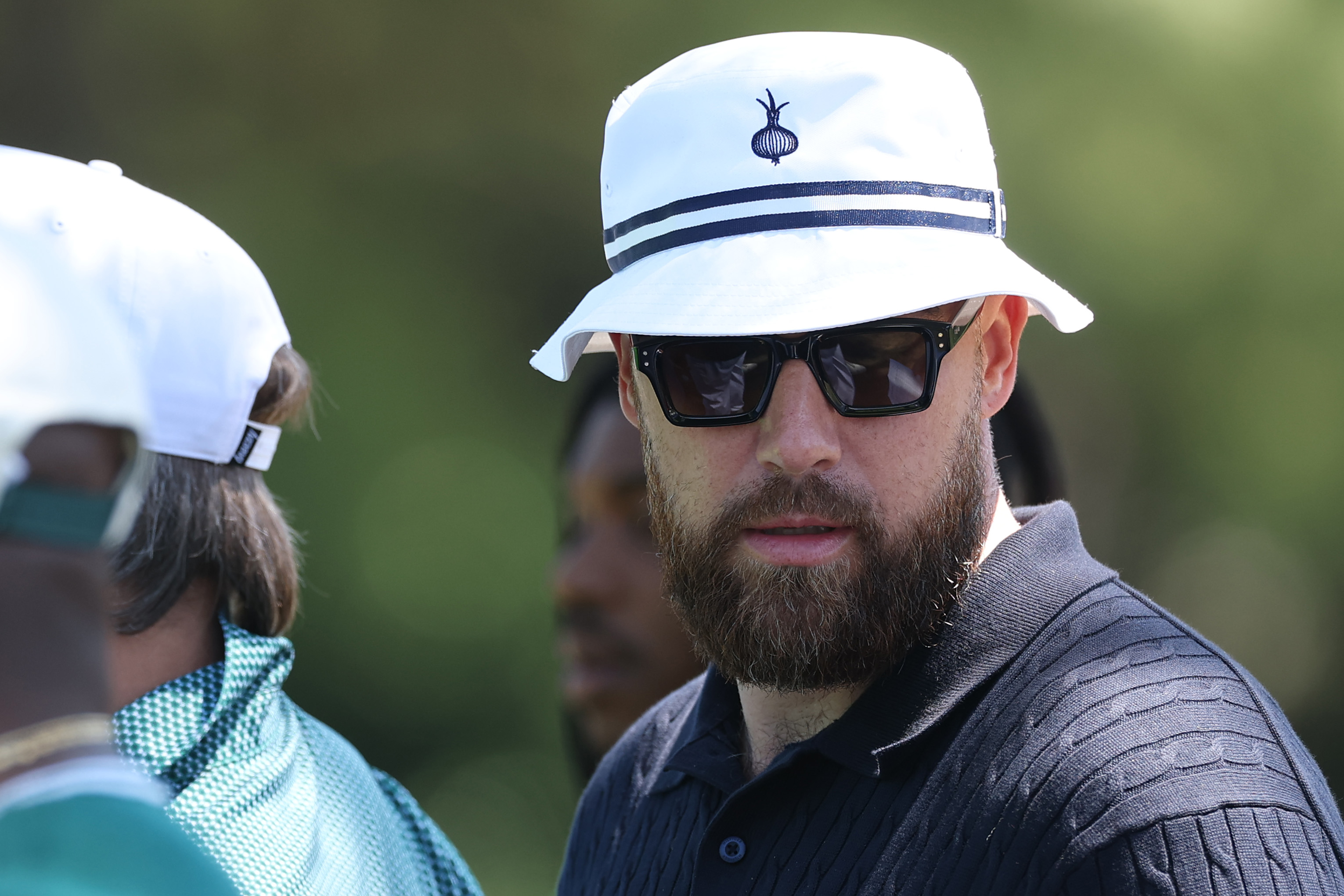Travis Kelce is seen near the 14th green during the second round of the 2026 Masters Tournament at Augusta National Golf Club