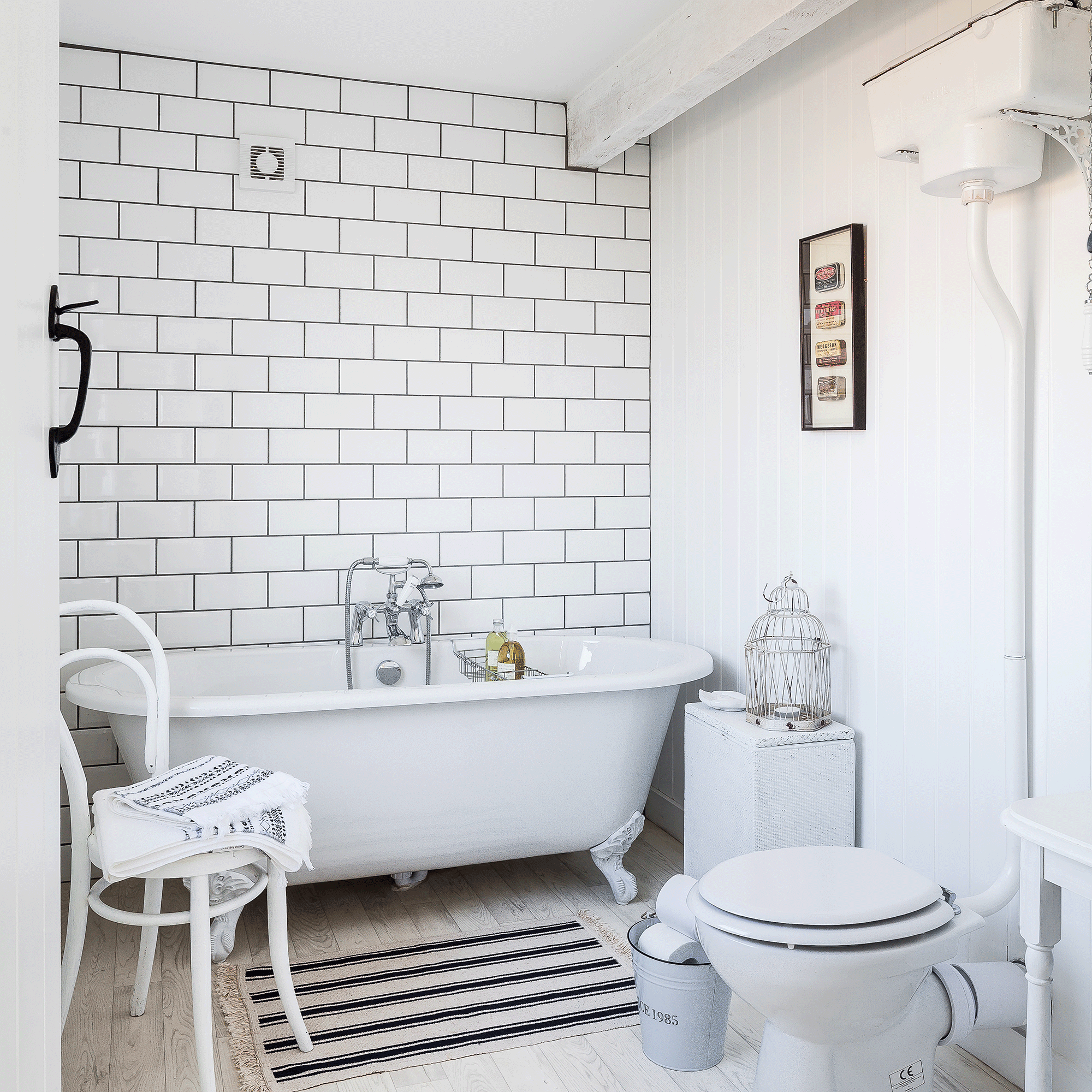 White bathtub and white tiles